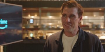 Pat Cummins watches on with fans in Sydney as Australia is victorious over England in ICC Champions Trophy match-up