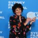 Fadia Abboud holds the 2026 Sydney UNESCO City of Film Award at the Sydney Film Festival Closing Night Gala.