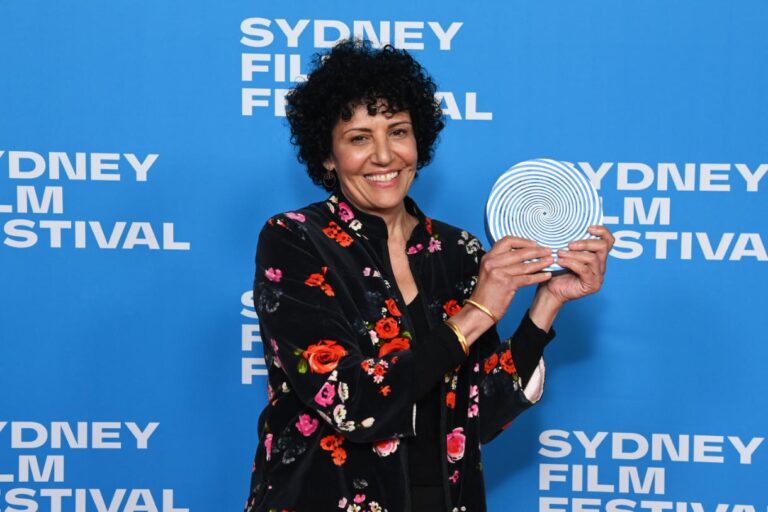 Fadia Abboud holds the 2026 Sydney UNESCO City of Film Award at the Sydney Film Festival Closing Night Gala.