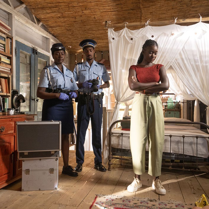 Police investigate a murder scene during the season finale of Death in Paradise.