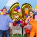 Play School presenters celebrate the programme's 60th anniversary alongside giant gold number 60 balloons.