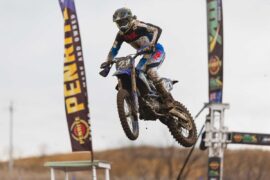A motocross rider launches through the air during ProMX 2026 Round 5 at Appin, New South Wales.