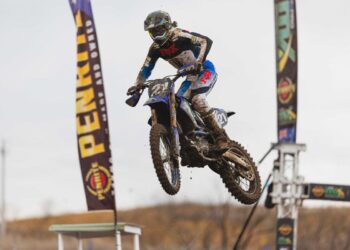 A motocross rider launches through the air during ProMX 2026 Round 5 at Appin, New South Wales.