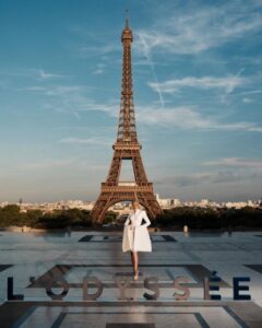The cast of The Odyssey gathers in Paris beneath the Eiffel Tower for a twilight photo shoot.