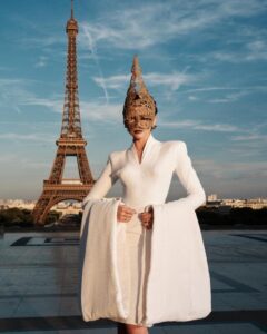 The cast of The Odyssey gathers in Paris beneath the Eiffel Tower for a twilight photo shoot.