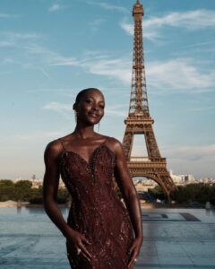 The cast of The Odyssey gathers in Paris beneath the Eiffel Tower for a twilight photo shoot.