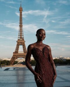 The cast of The Odyssey gathers in Paris beneath the Eiffel Tower for a twilight photo shoot.