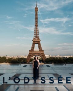 The cast of The Odyssey gathers in Paris beneath the Eiffel Tower for a twilight photo shoot.