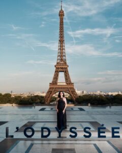 The cast of The Odyssey gathers in Paris beneath the Eiffel Tower for a twilight photo shoot.