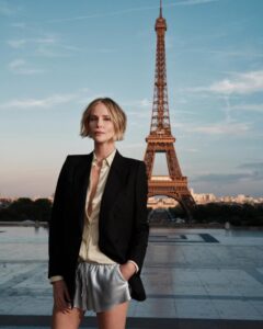 The cast of The Odyssey gathers in Paris beneath the Eiffel Tower for a twilight photo shoot.