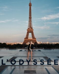 The cast of The Odyssey gathers in Paris beneath the Eiffel Tower for a twilight photo shoot.