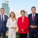 7NEWS Perth presenters standing in front of the Perth city skyline
