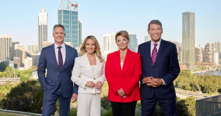 7NEWS Perth presenters standing in front of the Perth city skyline