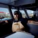 Jeff Mackinnon sits inside a boat in The Death Coast final episode on SBS Viceland.