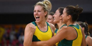 Australian netball players celebrate during a Commonwealth Games-style match.