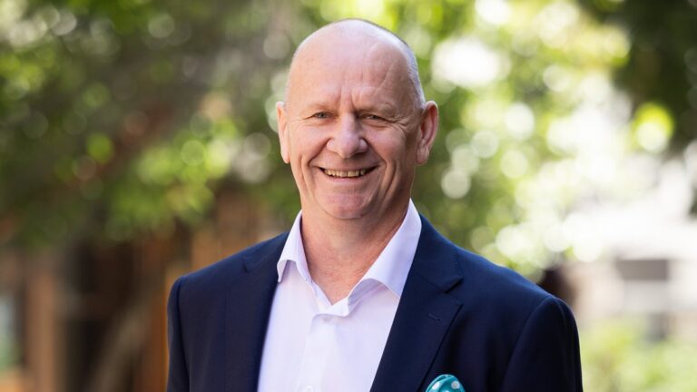 Ken Hinkley pictured with a Kayo Sports football