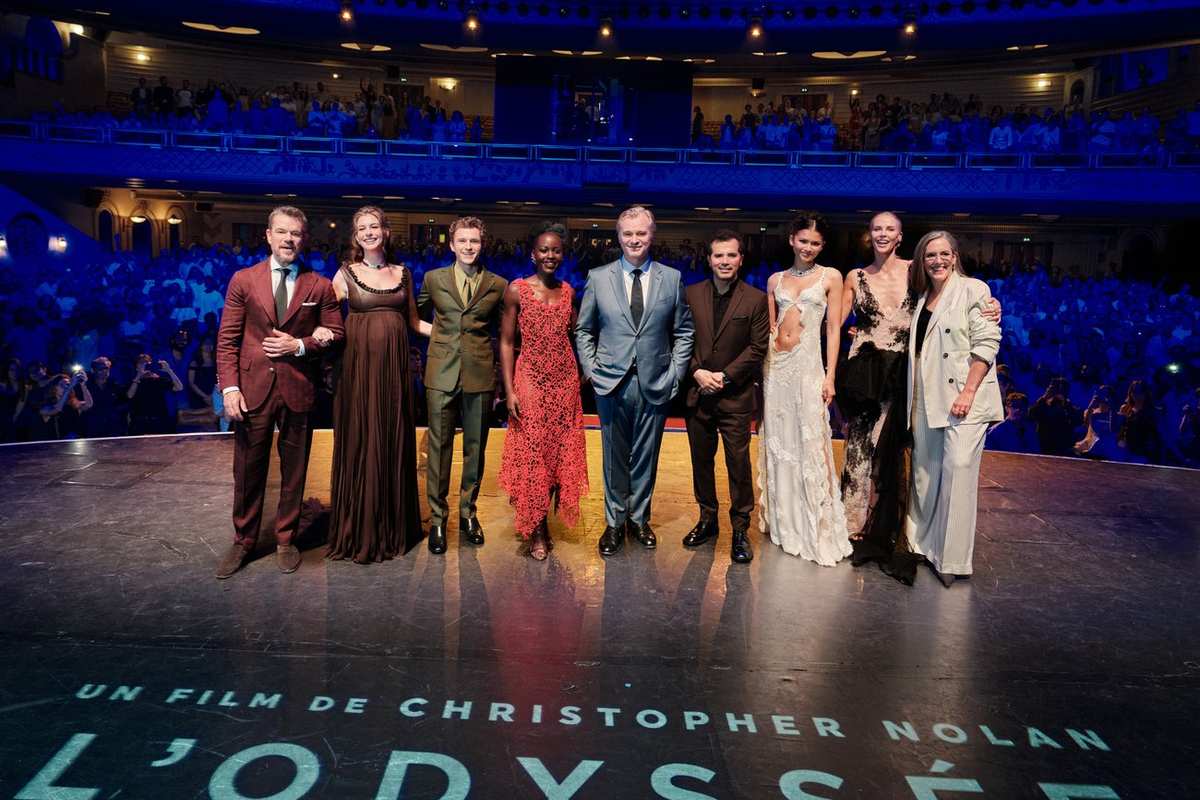 The cast of The Odyssey with Christopher Nolan and Emma Thomas at the Paris premiere