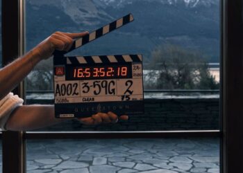 Clapperboard on the set of Netflix series Queenstown with New Zealand mountains in the background