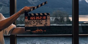 Clapperboard on the set of Netflix series Queenstown with New Zealand mountains in the background