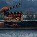 Clapperboard on the set of Netflix series Queenstown with New Zealand mountains in the background