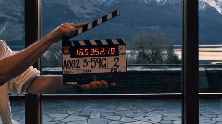 Clapperboard on the set of Netflix series Queenstown with New Zealand mountains in the background