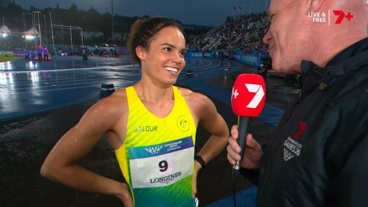 Torrie Lewis reacts after running under 11 seconds at Glasgow 2026.