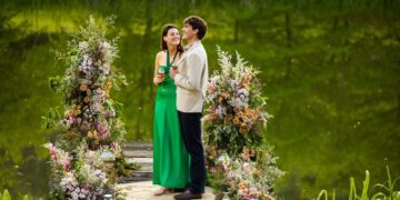 Zac and Maya from Farmer Wants A Wife 2026 standing together beside a lake