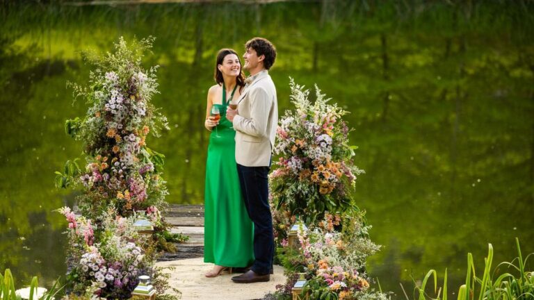 Zac and Maya from Farmer Wants A Wife 2026 standing together beside a lake