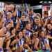 North Melbourne players celebrate with the AFLW premiership cup