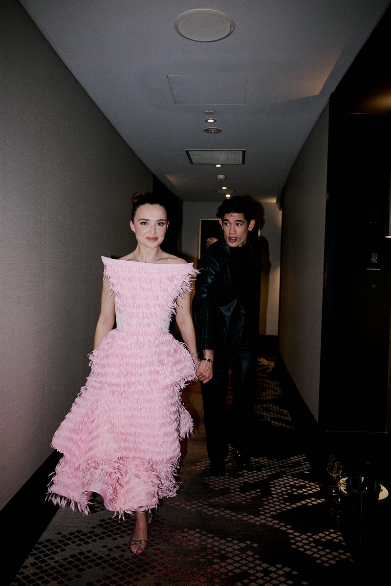 Philippa Northeast and Christopher Chung walk through a hallway before the Logies
