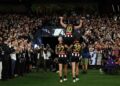 Scott Pendlebury celebrates his record-breaking 433rd AFL game