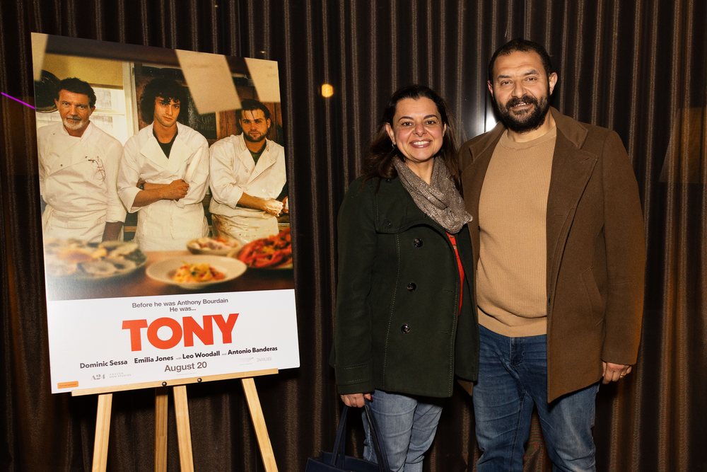 Guests pose beside TONY signage at the Sydney preview screening