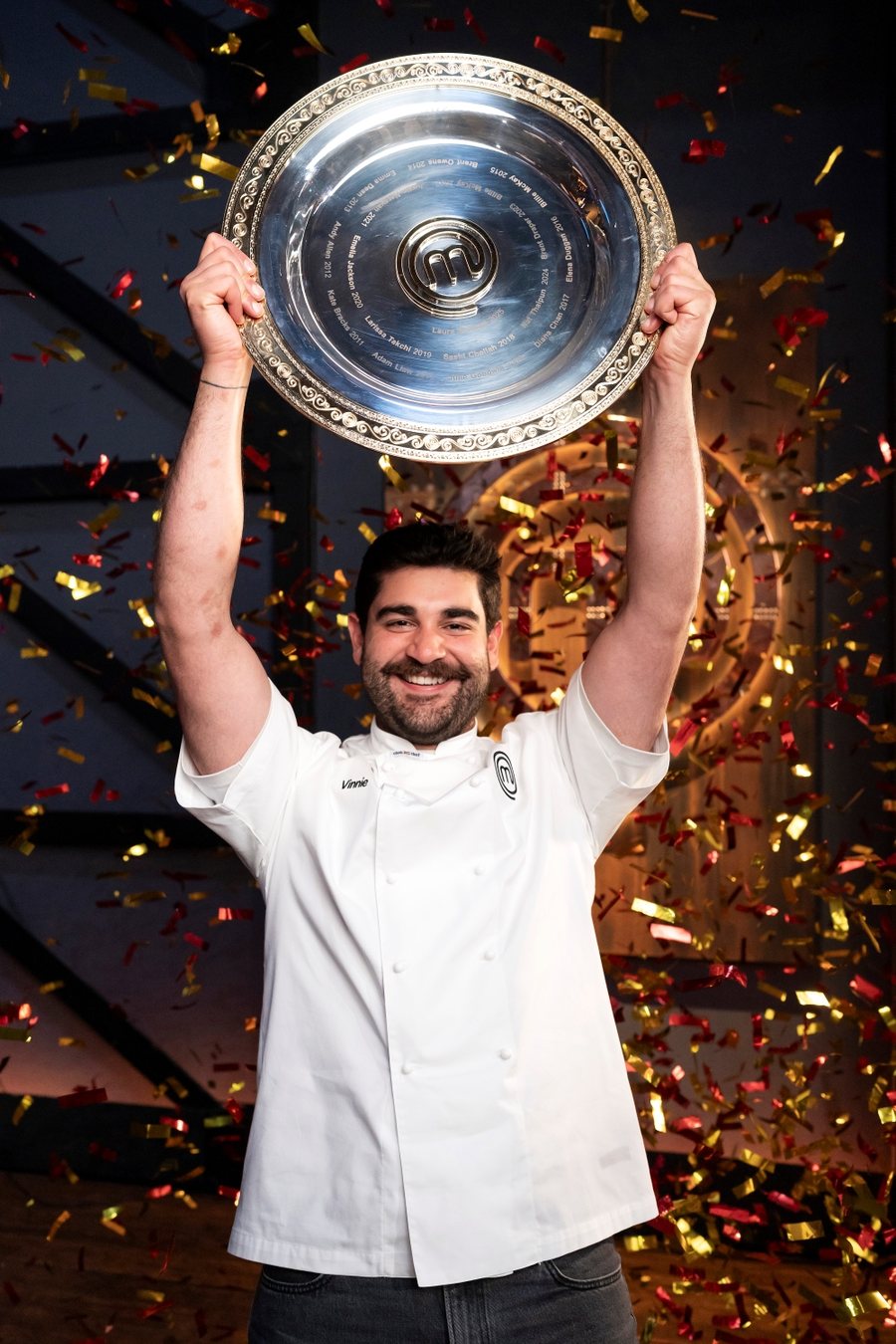 Vinnie Gibaldi lifting the MasterChef Australia trophy after winning the 2026 season