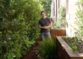 Charlie stands in a garden side passage on Better Homes and Gardens