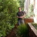 Charlie stands in a garden side passage on Better Homes and Gardens