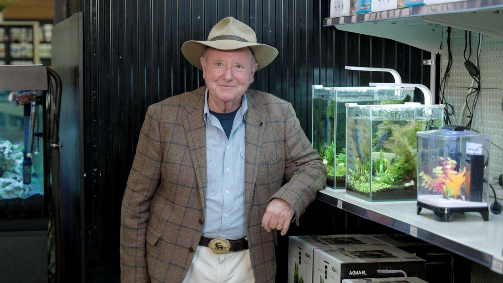 Dr Harry beside mini aquariums on Better Homes and Gardens