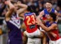 Brisbane Lions players celebrate winning the 2026 AFL Grand Final