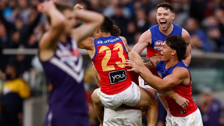 Brisbane Lions players celebrate winning the 2026 AFL Grand Final