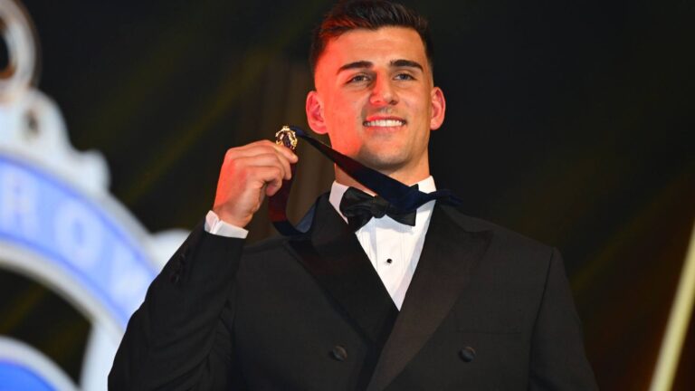 Nick Daicos holds the 2026 Brownlow Medal after his record-breaking win.