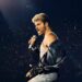 George Michael performing during The Faith Tour concert film.