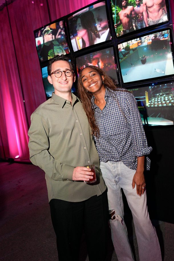 Guests at the Primetime premiere reception in front of television screens