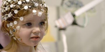 A young child undergoing an EEG assessment in the documentary Raising Superheroes