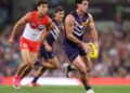 Fremantle Dockers player in possession against the Sydney Swans during the AFL finals