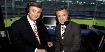 Dennis Cometti and Bruce McAvaney at an AFL commentary desk