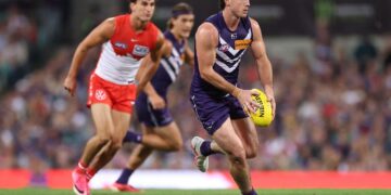 Fremantle Dockers player in possession against the Sydney Swans during the AFL finals