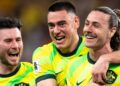 CommBank Socceroos players celebrate on the pitch