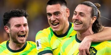 CommBank Socceroos players celebrate on the pitch