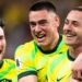 CommBank Socceroos players celebrate on the pitch