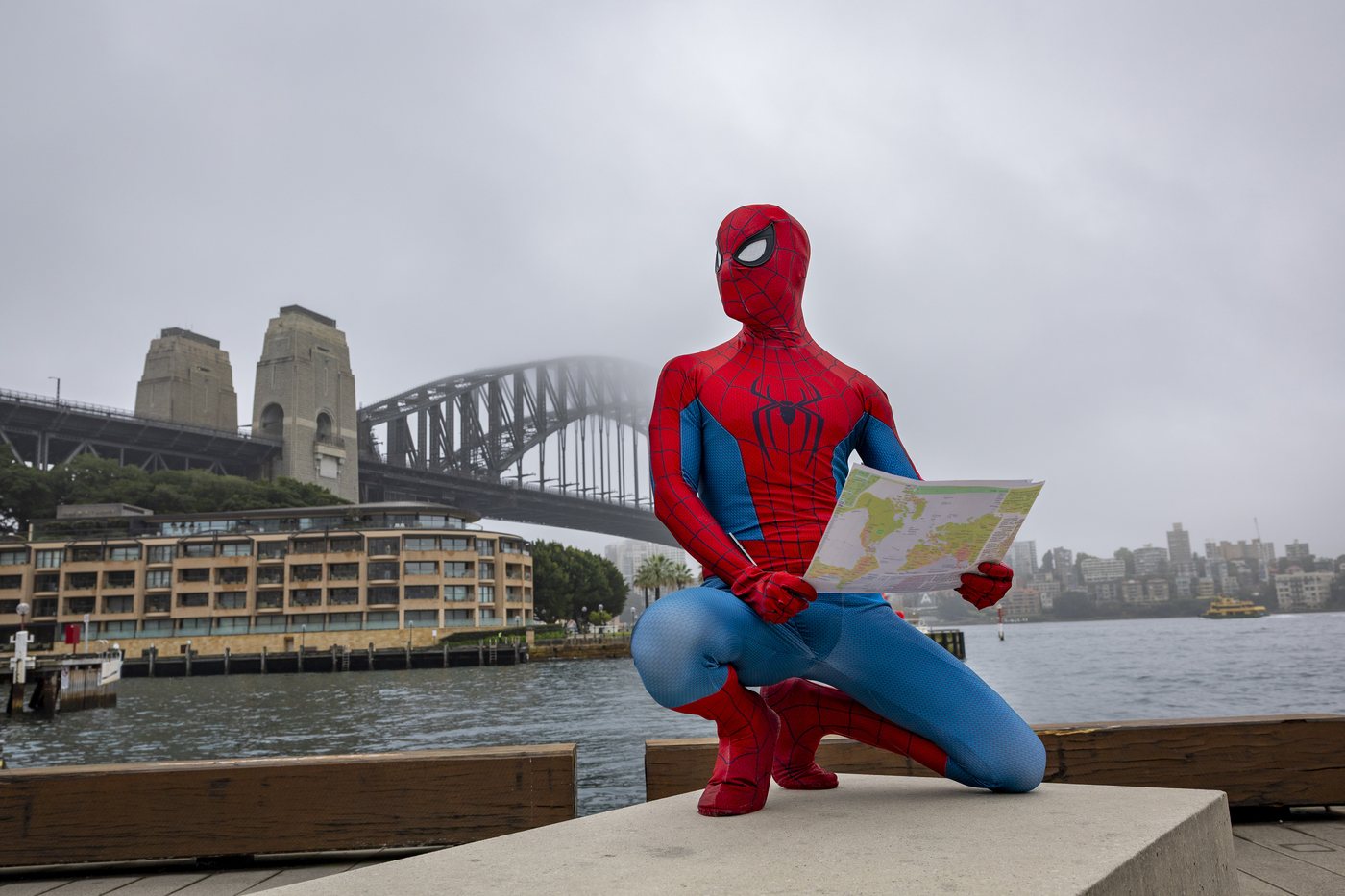 Spider-Man posing near the Sydney Harbour Bridge before the Circular Quay event