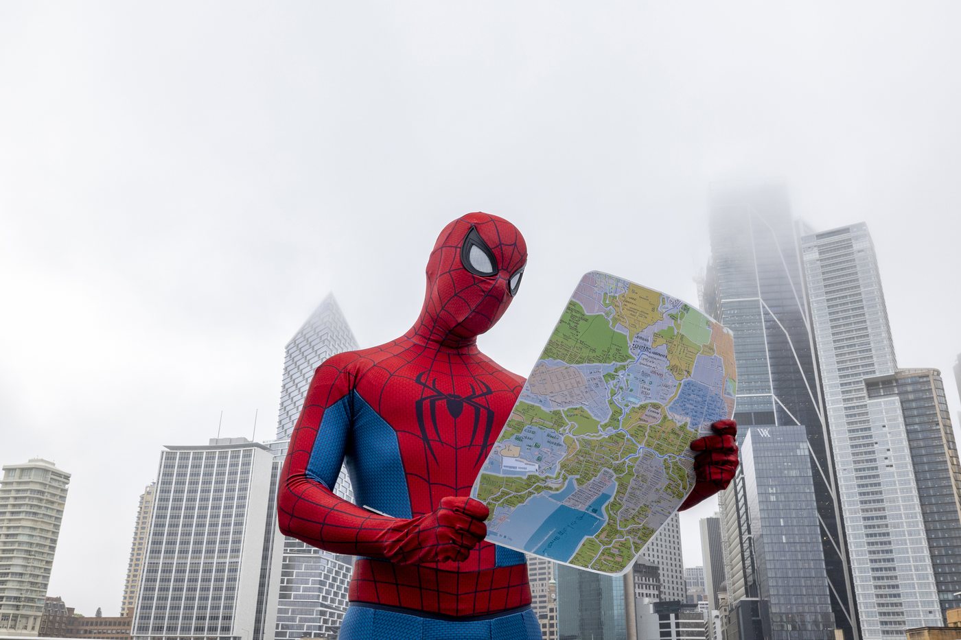 Spider-Man holding a Sydney map at Circular Quay for the Brand New Day fan pop-up